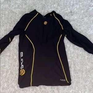 Skins compression running top